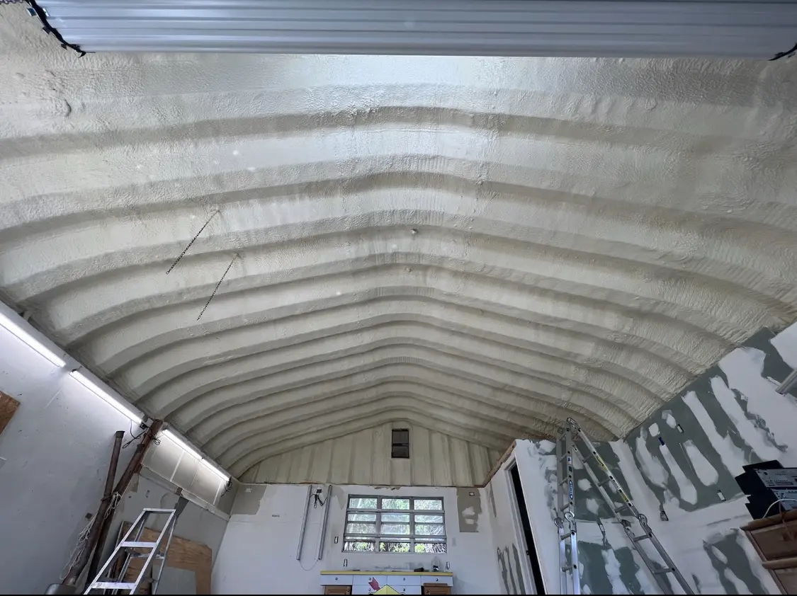 Spray polyurethane foam applied to the underside of a metal roof deck in Waynesville